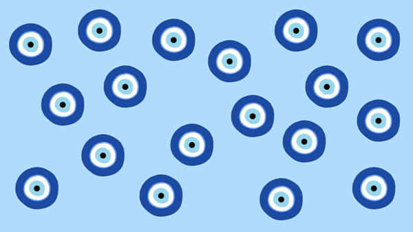Download Evil Eye Pattern On A Blue Background | Wallpapers.com