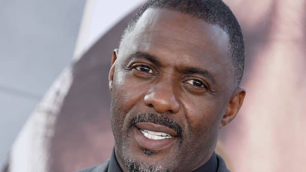 Download Idris Elba In Gray Suit And Black Inner Wallpaper | Wallpapers.com