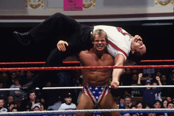 Download Lex Luger Standing Beside Jim Ross Wallpaper | Wallpapers.com