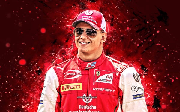 Download Mick Schumacher Standing With Raised Fists Wallpaper ...