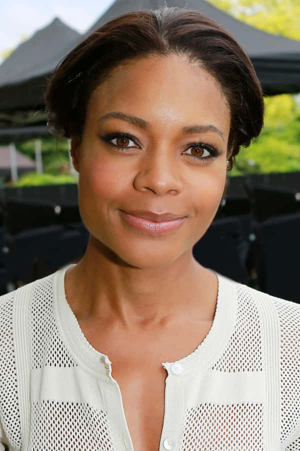 Download British Actress Naomie Harris Smiling Wallpaper | Wallpapers.com