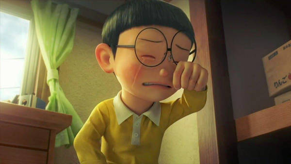 Download Sad Nobita Holding Flower Doraemon Wallpaper | Wallpapers.com