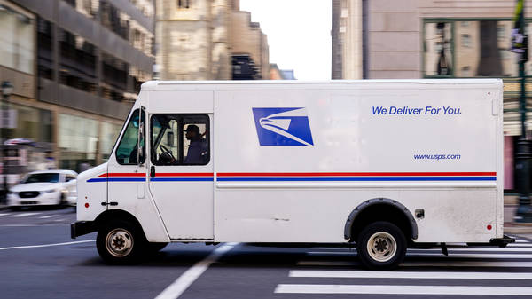 Download Two USPS Tracking Trucks Cart Wallpaper | Wallpapers.com