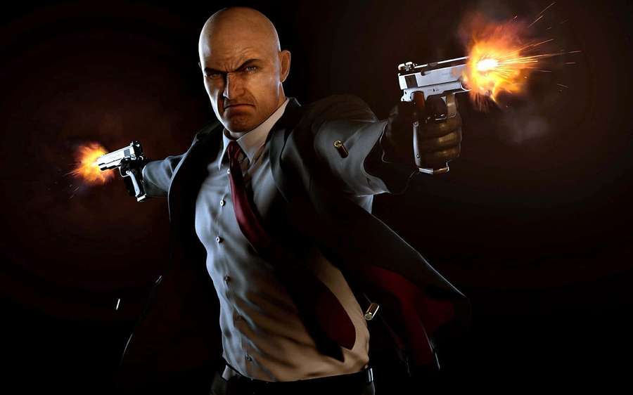 A bald assassin in a suit firing two pistols with muzzle flashes. — 1080p Hitman Absolution Background