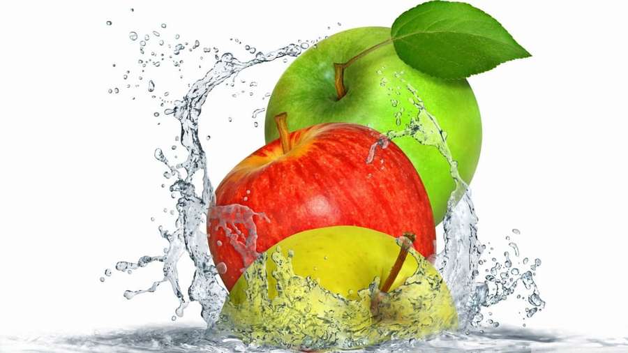 Three colorful apples splashing through water on a white background. — 1366x768 Apple Background