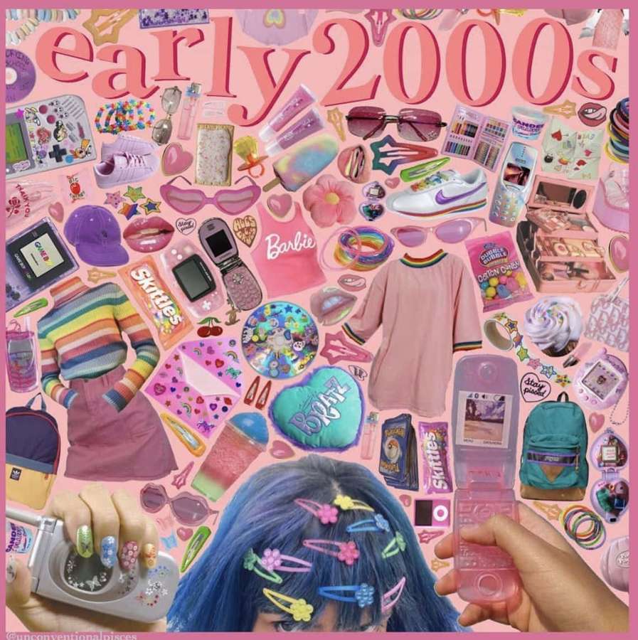 A person with blue hair and colorful clips holds a camera and phone surrounded by 2000s memorabilia. — 2000s Background