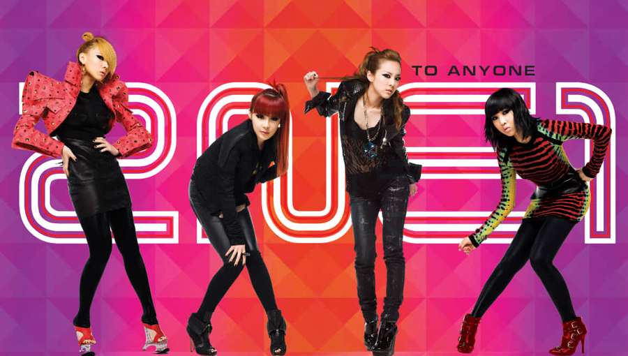Four stylish women in bold outfits posing energetically against a colorful geometric backdrop. — 2ne1 Background