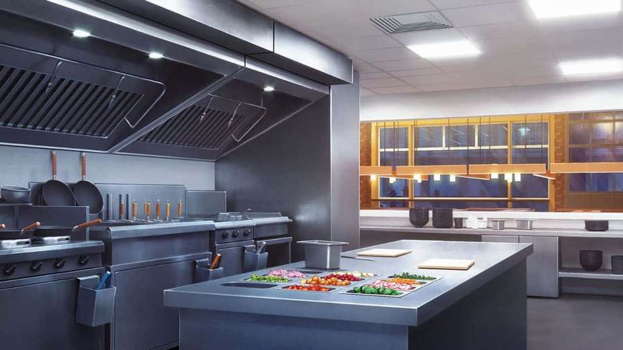 Professional kitchen with stainless steel equipment and fresh vegetables on a central island. — 720p Kitchen Background