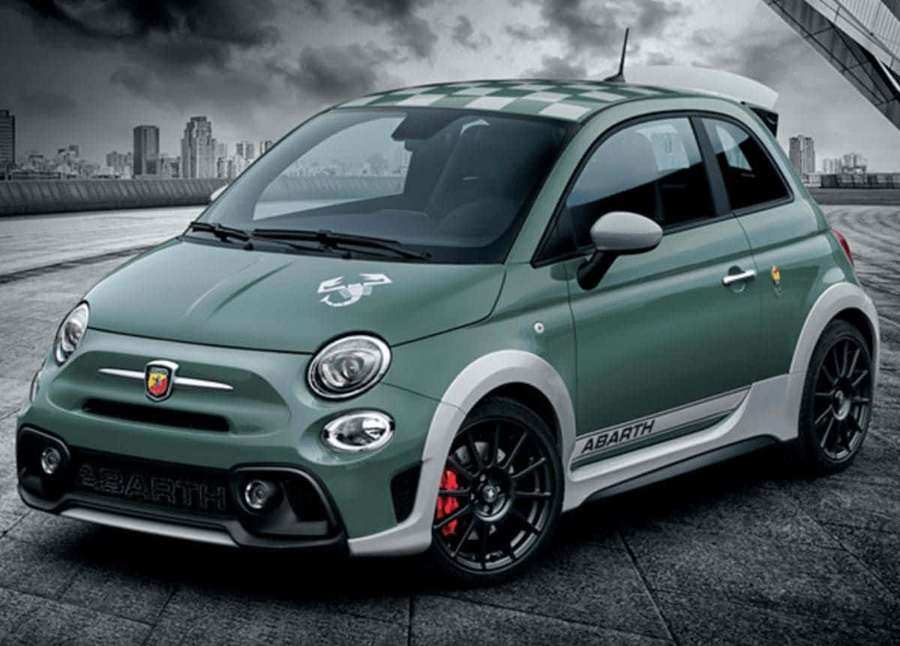 Green Abarth 595 sports car on city rooftop with stormy sky background. — Abarth 695 Wallpaper