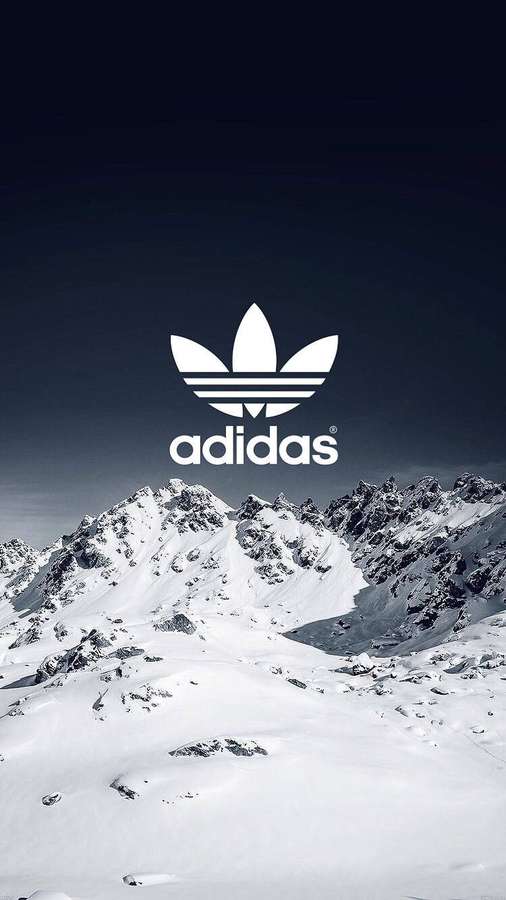 Logo bianco adidas su montagne innevate sotto cielo scuro — Adidas Sfondi