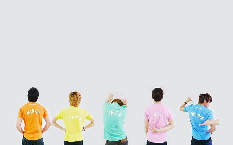 Five men in brightly colored t-shirts with names on back posing with backs to camera. — Aesthetic Korean Wallpaper