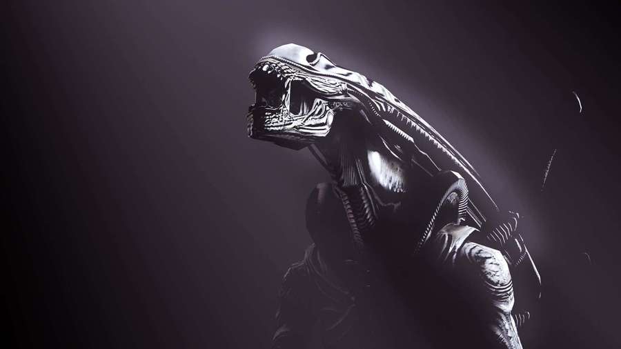 A menacing alien creature with a long head and sharp teeth illuminated by a spotlight. — Alien Background