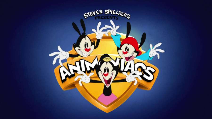Three animated rabbits in colorful outfits cheerfully posing around a golden shield logo. — Animaniacs Background