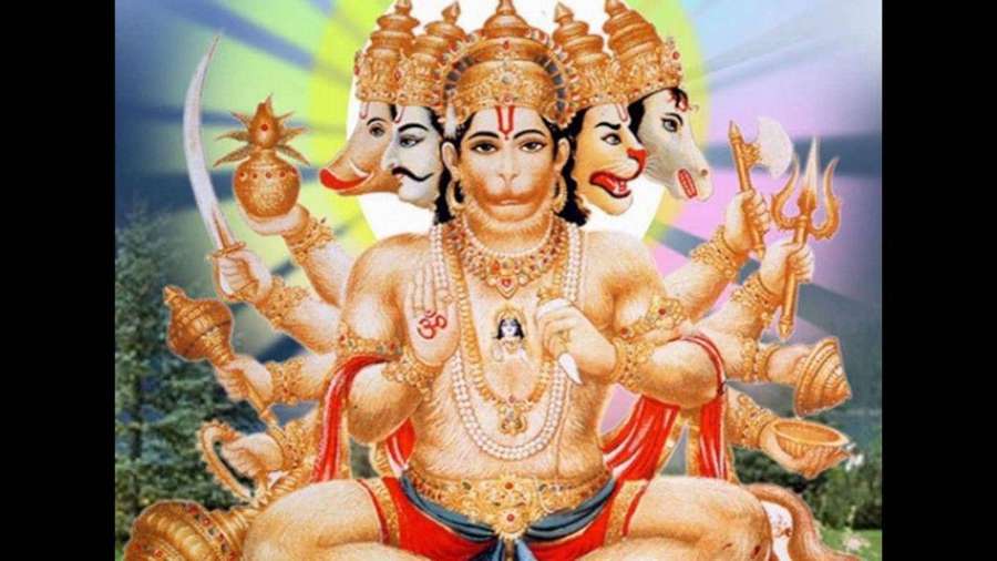 Hindu deity with multiple arms and animal heads holding sacred weapons in ornate golden attire. — Anjaneya Wallpaper