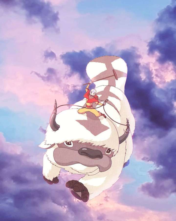 Un joven monje monta un bisonte volador a través de un cielo colorido. — Appa Avatar Fondos de pantalla
