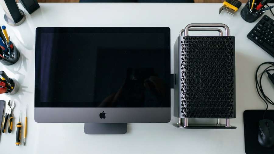 A top-down view of a Mac Studio and Studio Display in a clean setup. — Apple Desktop Picture