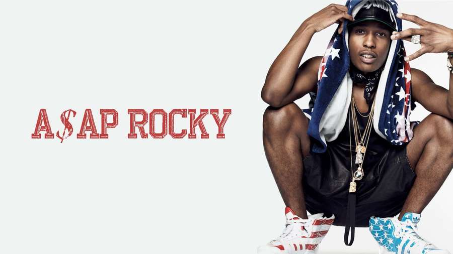 A$AP Rocky in patriotic outfit posing for a studio portrait. — Asap Rocky Background