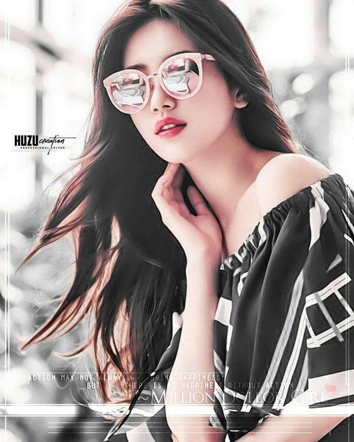 Eine stilvolle Frau in rosa Sonnenbrille und schwarz-weißem Top posiert in einer urbanen Umgebung. — Attitüde Mädchen Wallpaper
