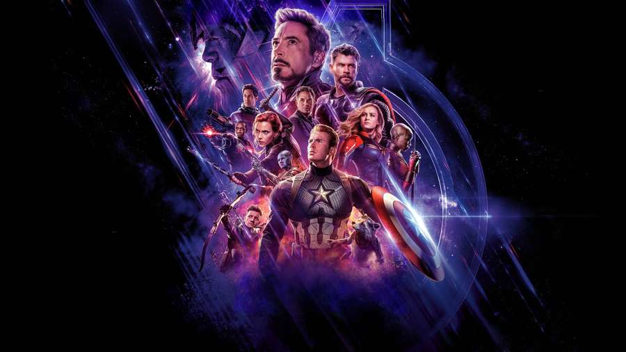 Avengers team in cosmic battle formation with energy beams and starfield. — Avengers Desktop Background