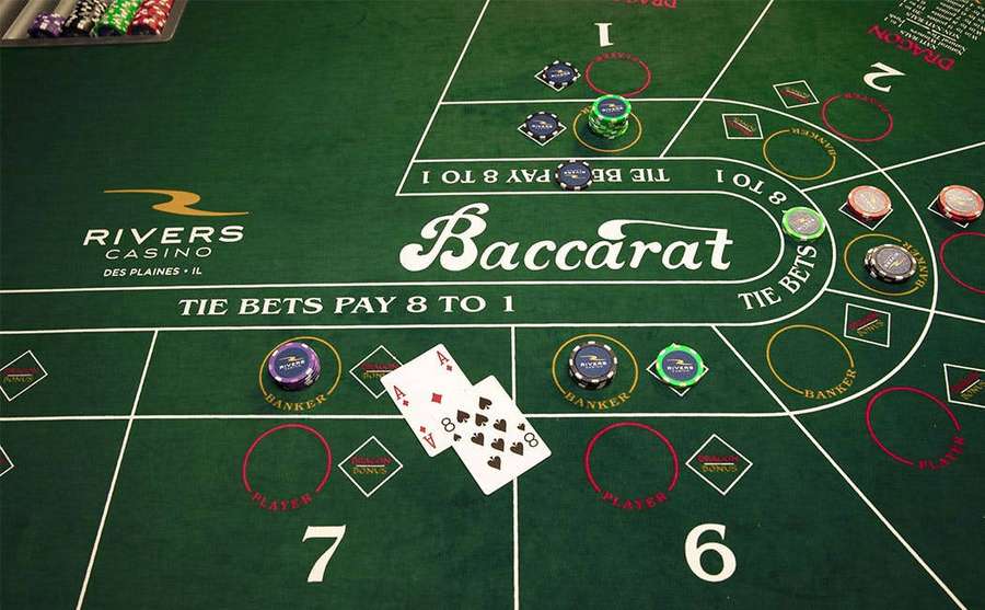 Baccarat table at Rivers Casino with cards and chips in play. — Baccarat Wallpaper