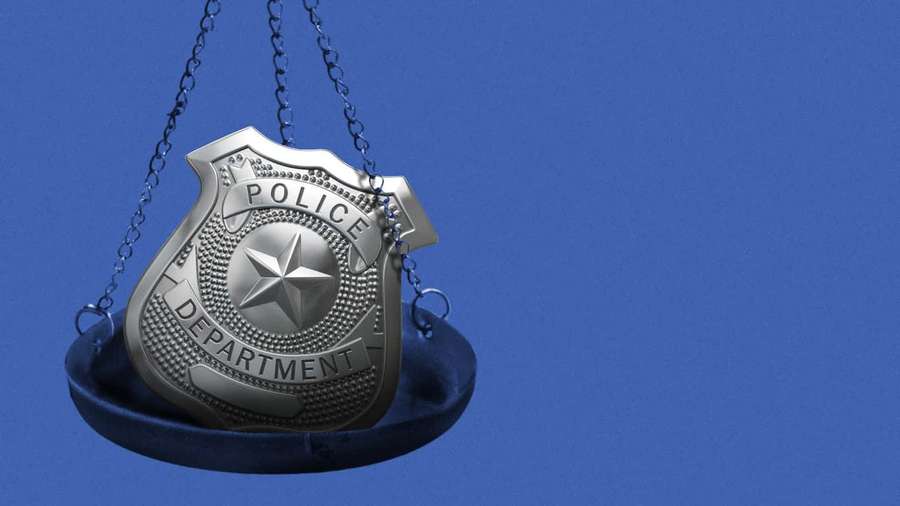 A police badge hanging on a scale against a blue background. — Badges Wallpaper