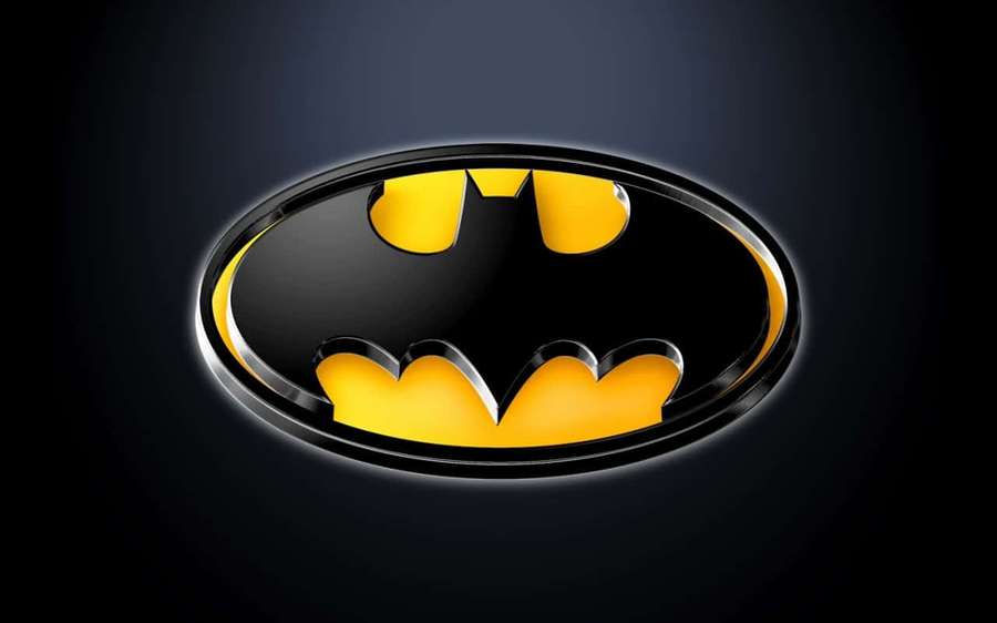 Glossy Batman logo with yellow bat emblem on dark background — Batman Background