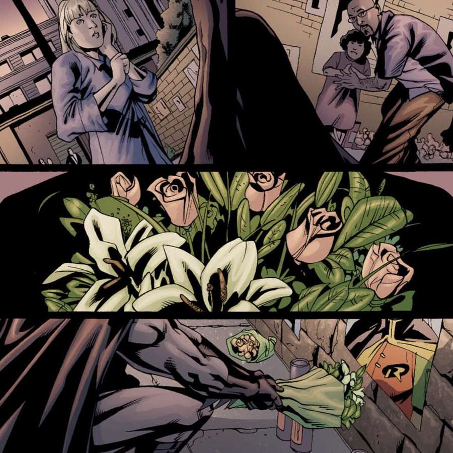 Batman places white lilies near Robin's costume in an urban alley scene. — Batman War Games Wallpaper