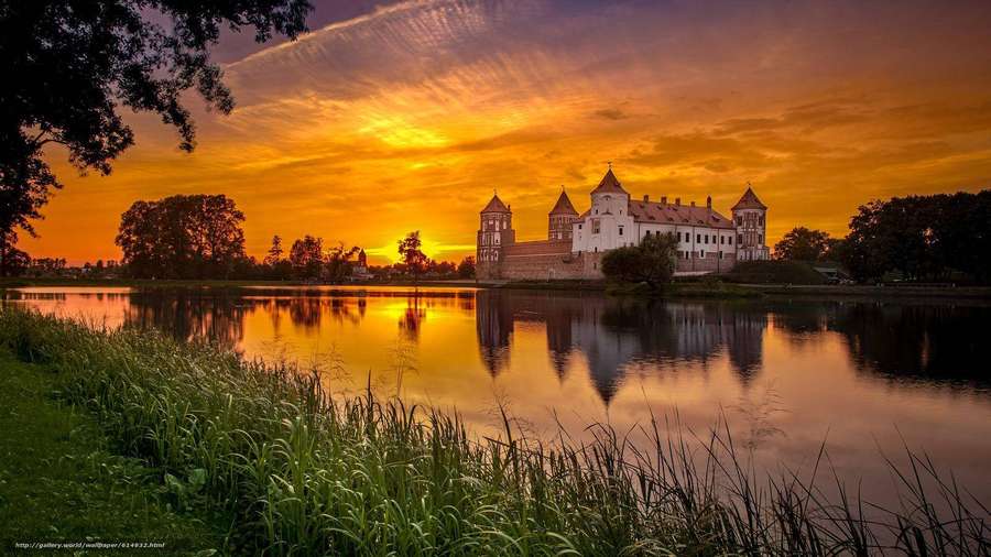 Castle reflected in water during vibrant sunset — Belarus Wallpaper