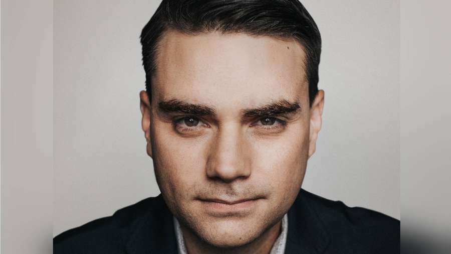 Close-up portrait of a man in a suit looking directly at the camera. — Ben Shapiro Wallpaper