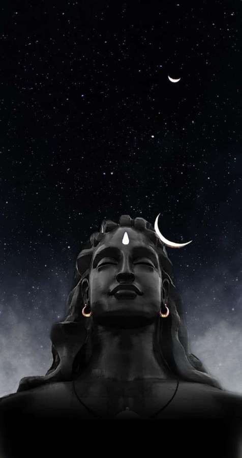Statue of Shiva with crescent moon hair under starry night sky — Best Shiva Wallpaper