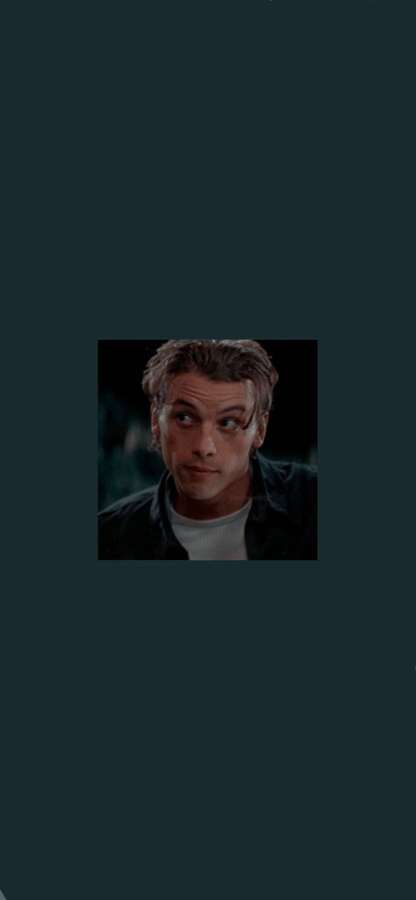 A man with intense eyes looking upward in a dark scene. — Billy loomis Wallpaper