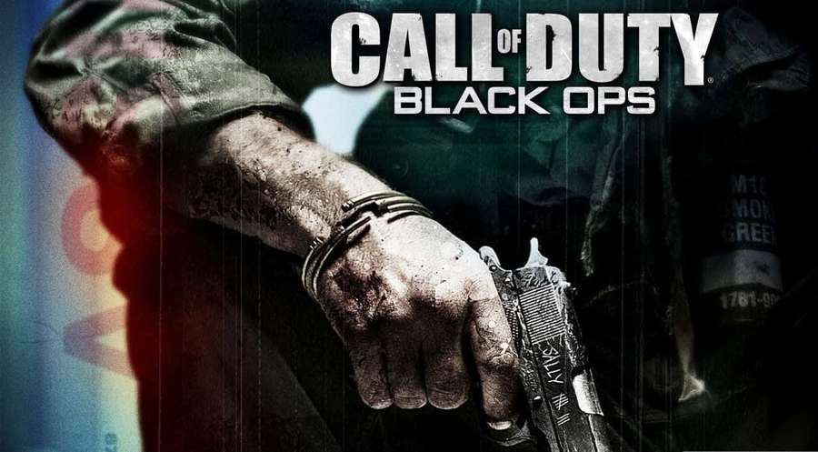 A soldier's bloodied hand holding a pistol with handcuffs on wrist. — Black Ops Wallpaper