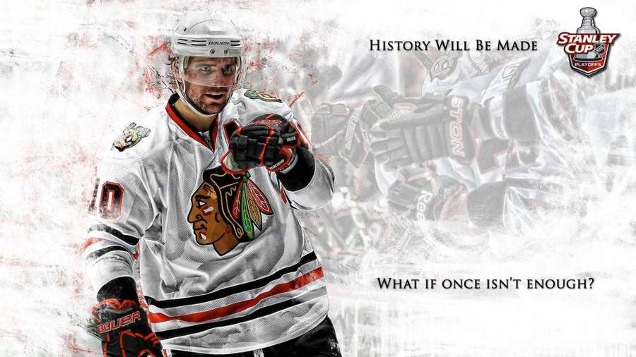Chicago Blackhawks hockey player in white jersey pointing forward with motivational text. — Blackhawks Wallpaper