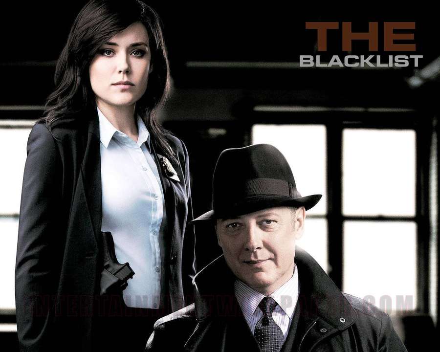 Two TV show agents in dark suits with serious expressions. — Blacklist Wallpaper