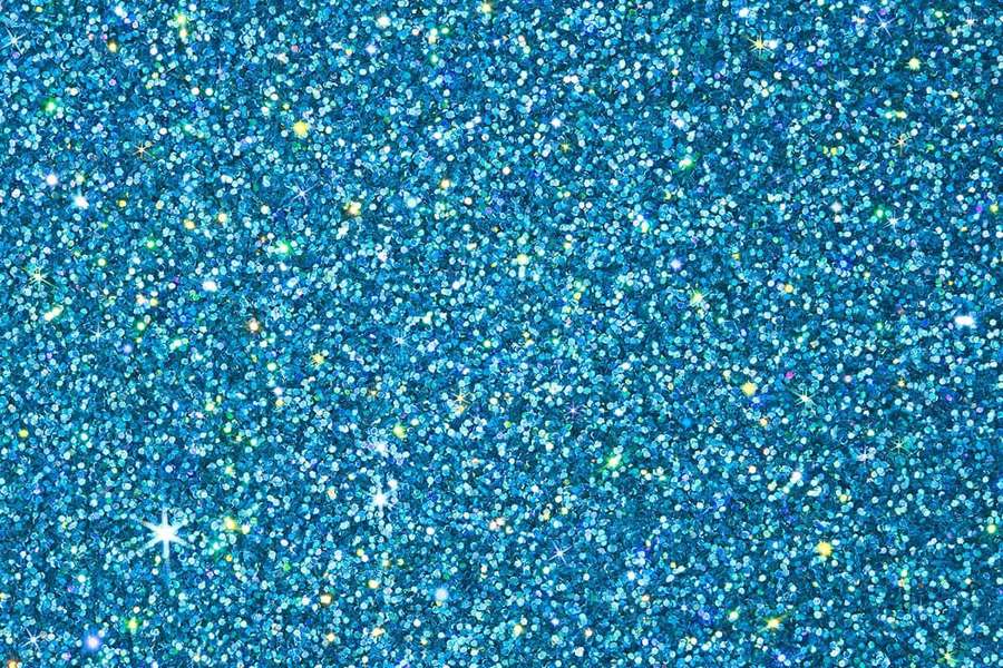 Blue glitter background with sparkling highlights and golden flecks.