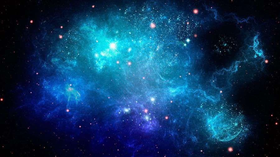 A glowing blue and teal nebula filled with stars in deep space. — Blue Space Picture