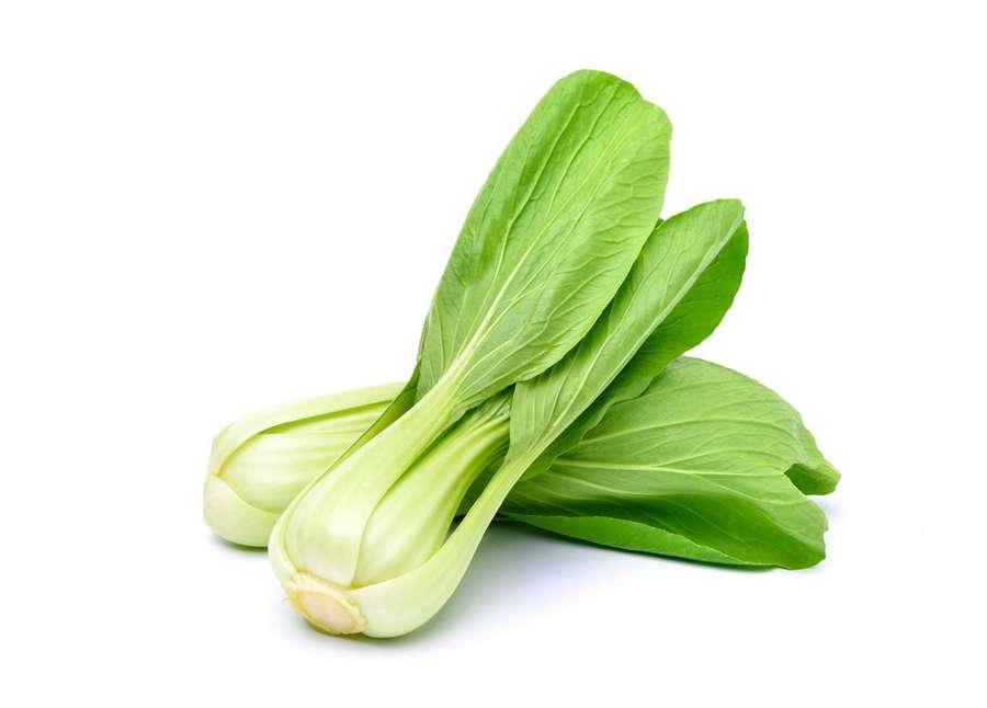 Fresh bok choy with green leaves and white stems on white background — Bok Choy Wallpaper