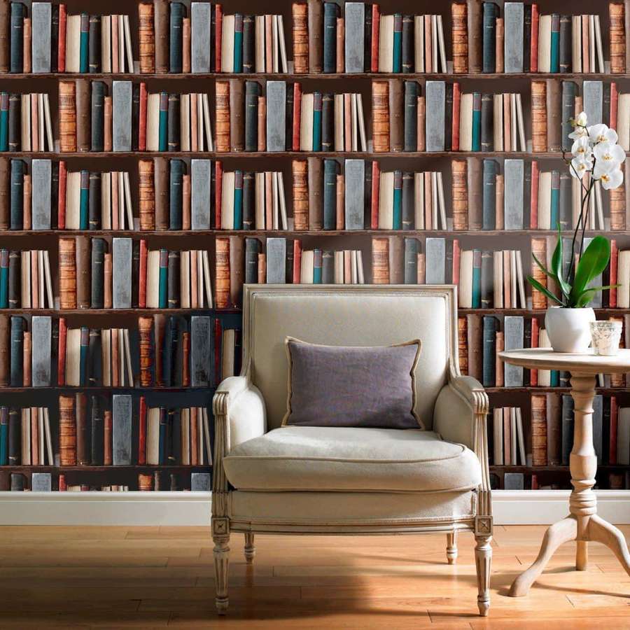 Cream armchair with purple pillow in front of a bookshelf wall with orchid on side table. — Bookshelf Background
