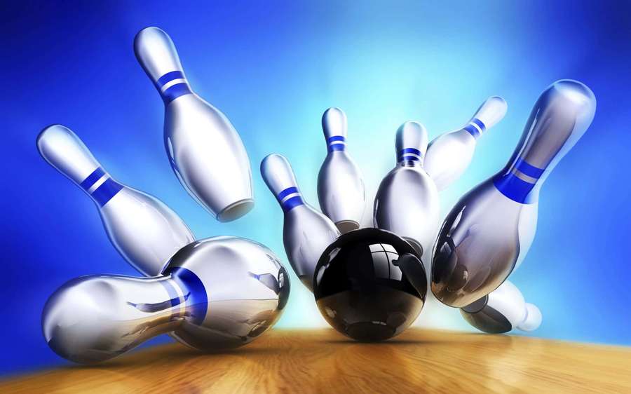 A black bowling ball hitting silver pins on a wooden lane with blue background. — Bowling Background