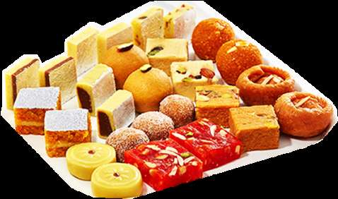 Platter of assorted Indian sweets including cubes balls and layered treats. — Bread PNG