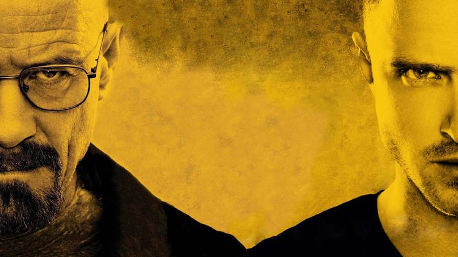Two men with intense expressions against a yellow textured background. — Breaking Wallpaper