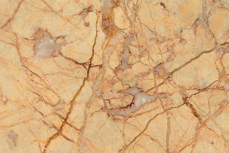 Close-up of beige marble with golden brown veins and gray patches. — Brown Marble Wallpaper