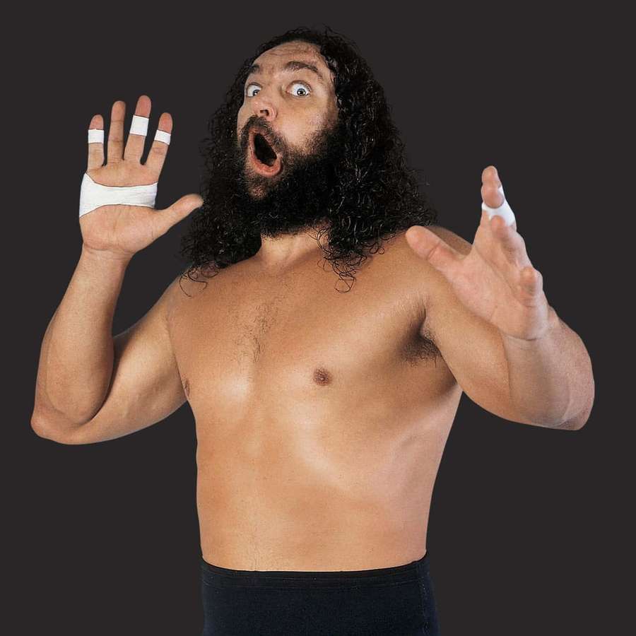 En wrestler med skæg og forbundne hænder skriger med store øjne. — Bruiser Brody Wallpapers