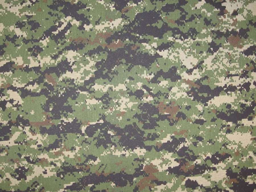 Military camouflage fabric with green brown and black pixelated pattern — Camo Background