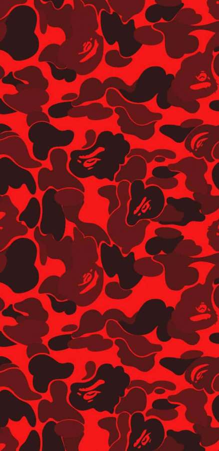 Rot-schwarzes Camouflage-Tapete mit stilisierten Gesichtsdesigns. — Camo Bilder