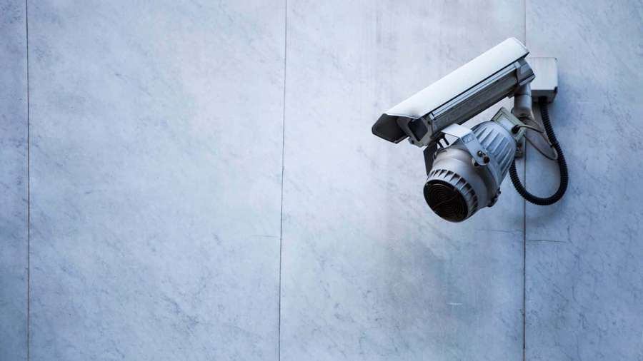Security camera mounted on a marble wall — Cctv Camera Wallpaper