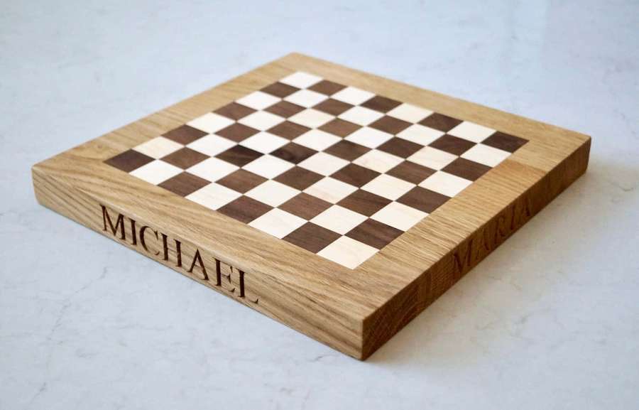 Personalized wooden chessboard with names Michael and Mara engraved on sides. — Chessboard Wallpaper