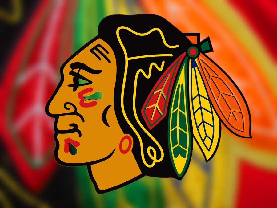 Chicago Blackhawks hockey team logo with colorful feathers and tribal face design. — Chicago Blackhawks Wallpaper
