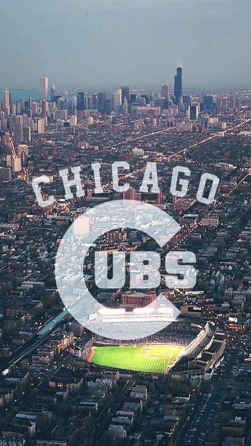Chicago Cubs baseball stadium in Wrigley Field with city skyline at dusk. — Chicago Cubs Background