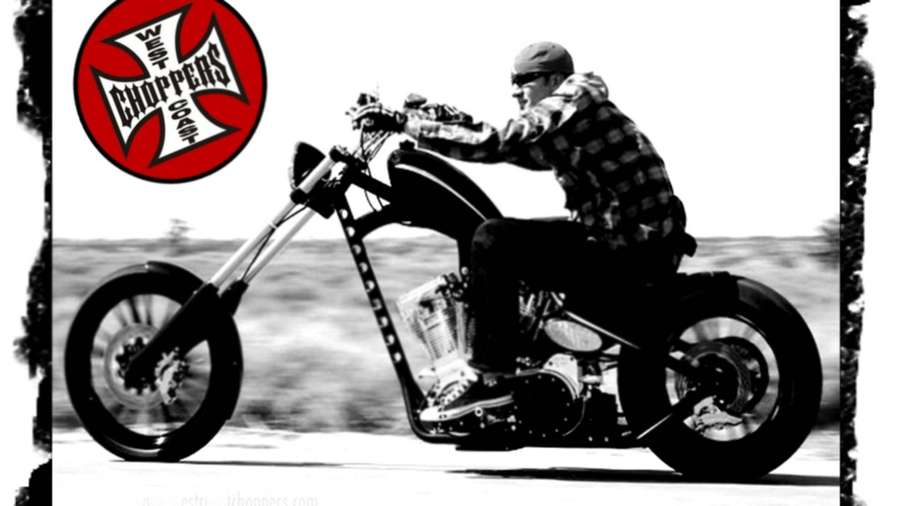 Biker riding custom chopper motorcycle with West Coast Choppers logo — Choppers Wallpaper